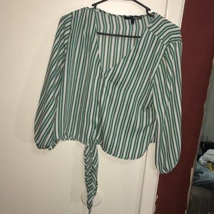 Green button up tie at the bottom shirt